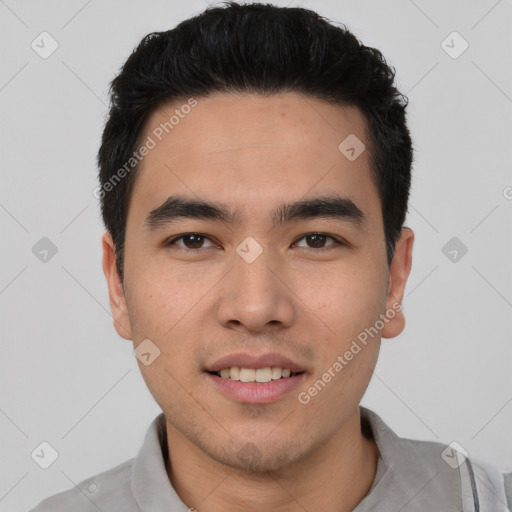 Joyful white young-adult male with short  black hair and brown eyes