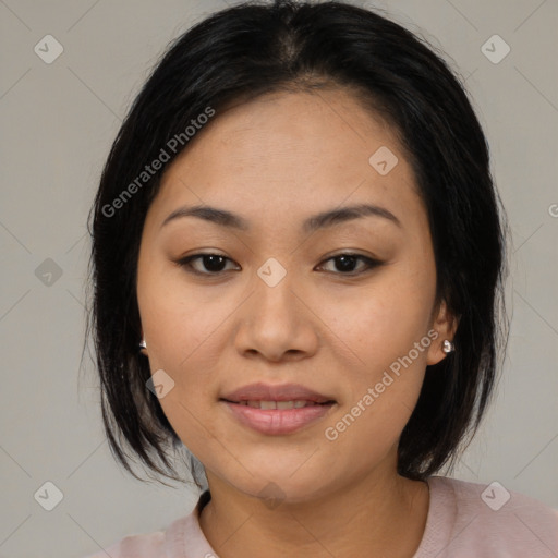 Joyful asian young-adult female with medium  black hair and brown eyes