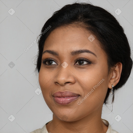 Joyful black young-adult female with medium  brown hair and brown eyes