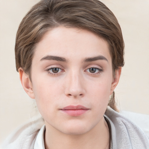 Neutral white young-adult female with short  brown hair and grey eyes