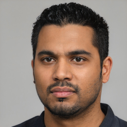 Neutral latino young-adult male with short  black hair and brown eyes