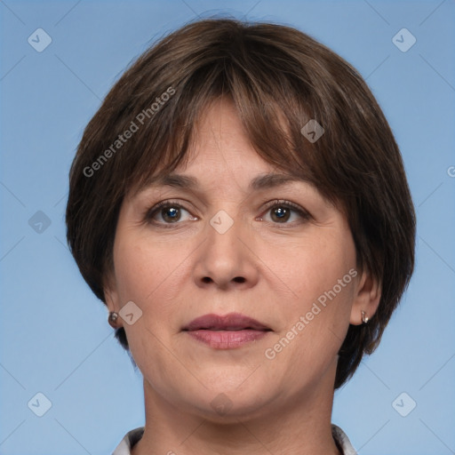 Joyful white adult female with medium  brown hair and brown eyes