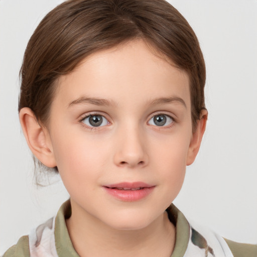 Joyful white child female with short  brown hair and brown eyes