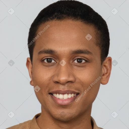 Joyful black young-adult male with short  brown hair and brown eyes