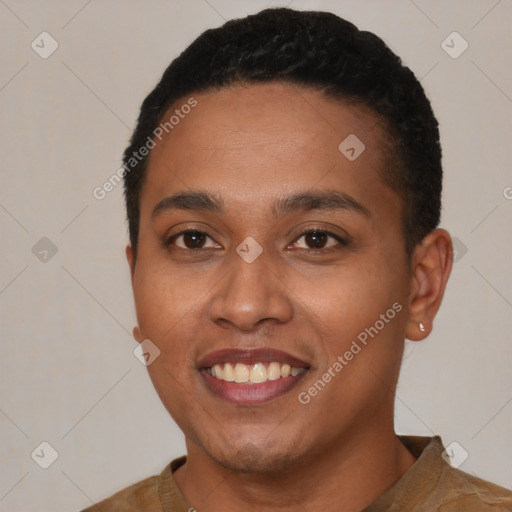 Joyful black young-adult female with short  black hair and brown eyes