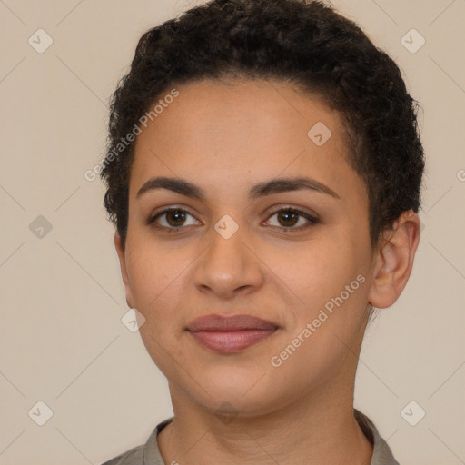 Joyful latino young-adult female with short  brown hair and brown eyes