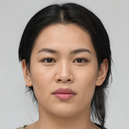 Joyful asian young-adult female with medium  brown hair and brown eyes