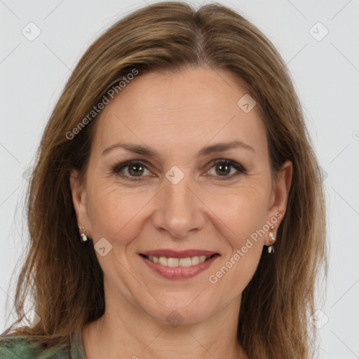 Joyful white adult female with medium  brown hair and brown eyes