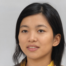 Joyful asian young-adult female with medium  black hair and brown eyes