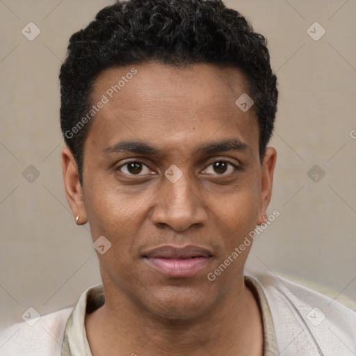 Joyful black young-adult male with short  black hair and brown eyes