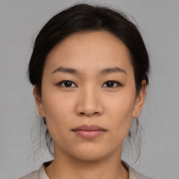 Neutral asian young-adult female with medium  brown hair and brown eyes