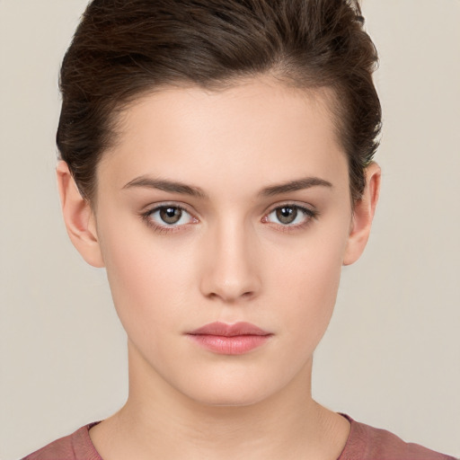 Neutral white young-adult female with short  brown hair and brown eyes