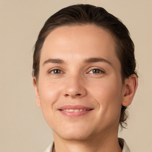 Joyful white young-adult female with short  brown hair and brown eyes