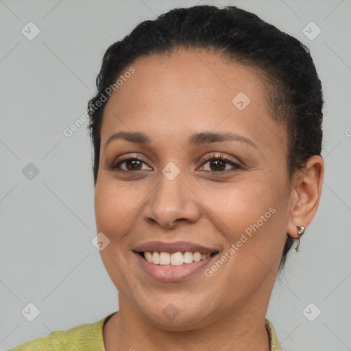 Joyful black young-adult female with short  brown hair and brown eyes