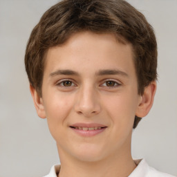 Joyful white child male with short  brown hair and brown eyes