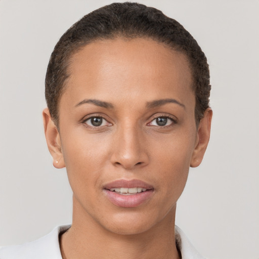 Joyful white young-adult female with short  brown hair and brown eyes