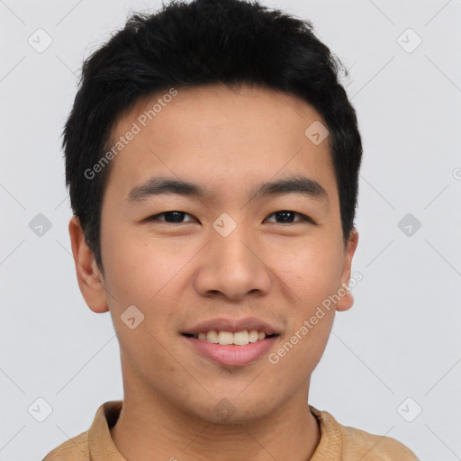 Joyful asian young-adult male with short  brown hair and brown eyes