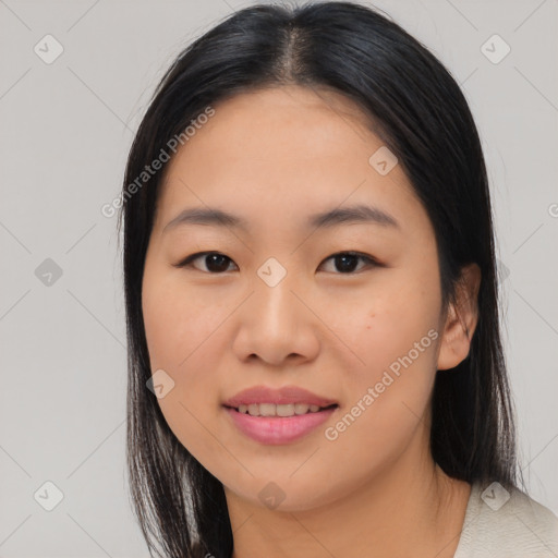 Joyful asian young-adult female with medium  black hair and brown eyes