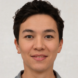 Joyful asian young-adult male with short  brown hair and brown eyes