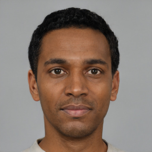 Neutral black young-adult male with short  black hair and brown eyes