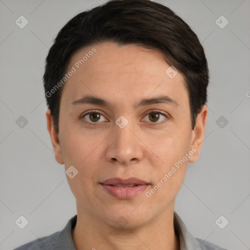 Joyful white adult male with short  black hair and brown eyes