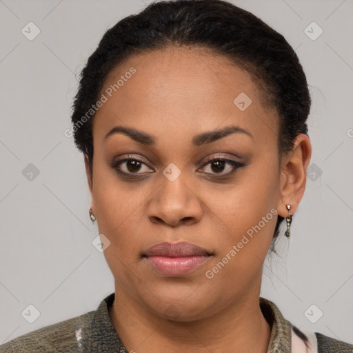 Joyful black young-adult female with short  black hair and brown eyes