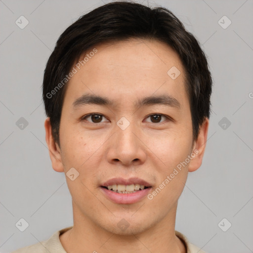 Joyful asian young-adult male with short  brown hair and brown eyes