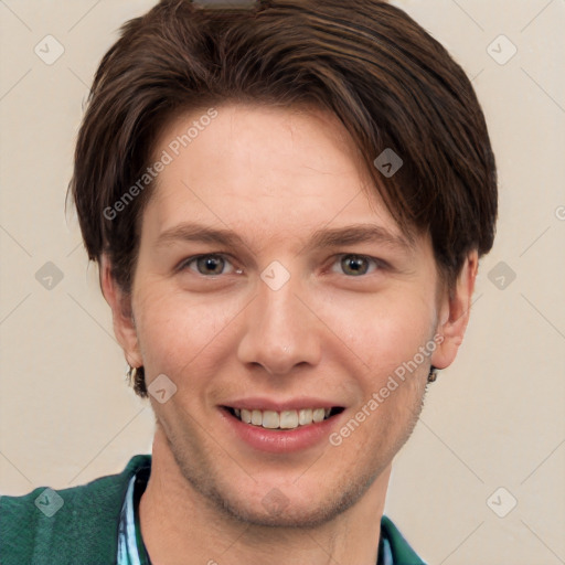 Joyful white young-adult male with short  brown hair and grey eyes