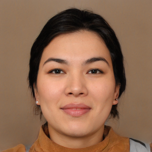 Joyful asian young-adult female with medium  brown hair and brown eyes