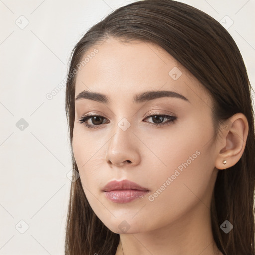 Neutral white young-adult female with long  brown hair and brown eyes