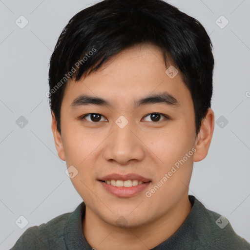 Joyful asian young-adult male with short  black hair and brown eyes