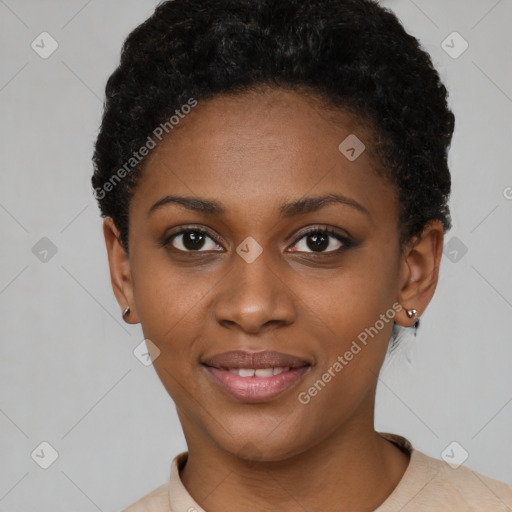 Joyful black young-adult female with short  black hair and brown eyes