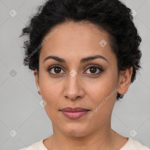 Joyful latino young-adult female with short  brown hair and brown eyes