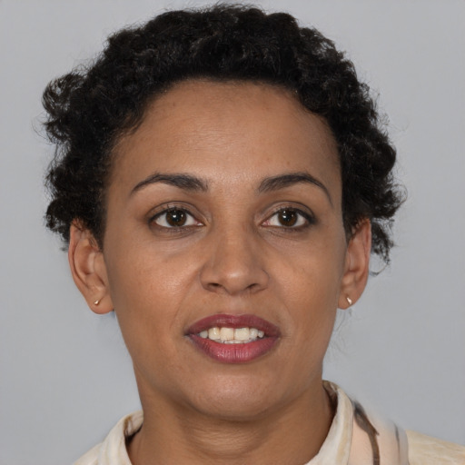 Joyful latino young-adult female with short  brown hair and brown eyes