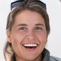 Joyful white young-adult female with medium  brown hair and blue eyes