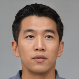 Neutral asian young-adult male with short  brown hair and brown eyes