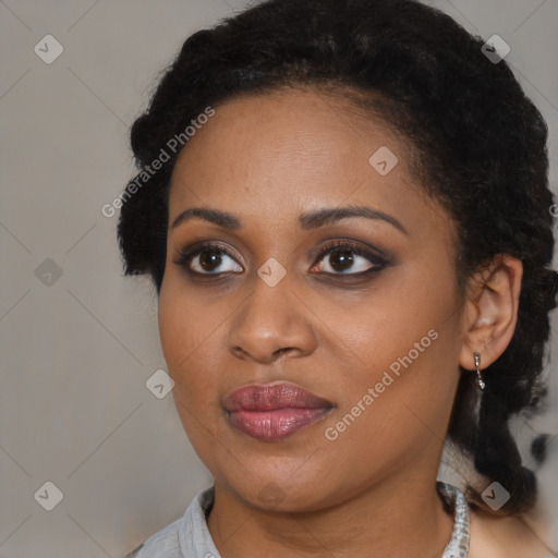 Joyful black young-adult female with medium  brown hair and brown eyes