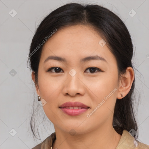 Joyful asian young-adult female with medium  brown hair and brown eyes