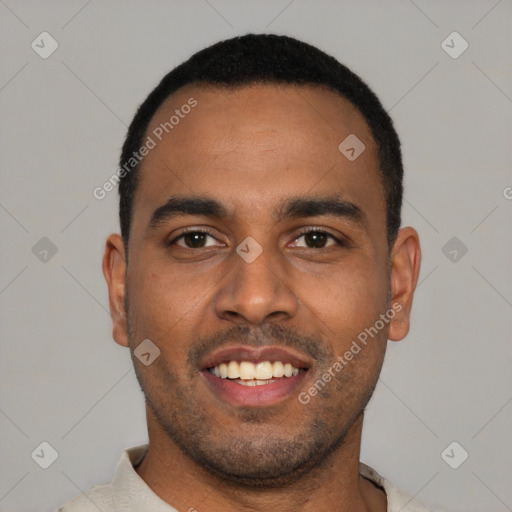 Joyful black young-adult male with short  black hair and brown eyes