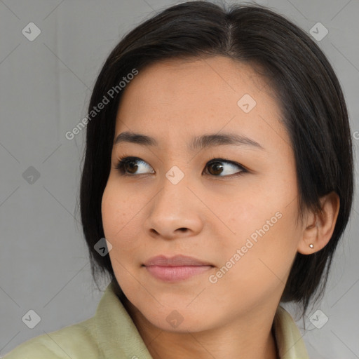 Joyful asian young-adult female with medium  brown hair and brown eyes