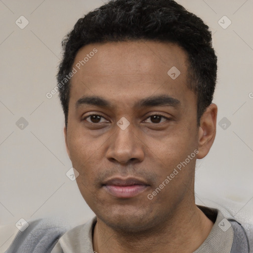 Neutral latino young-adult male with short  black hair and brown eyes