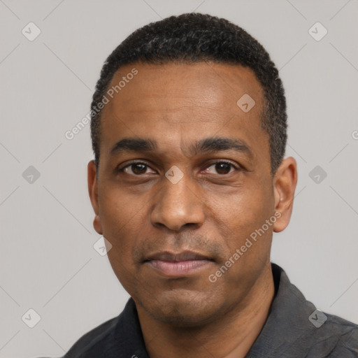 Neutral latino adult male with short  black hair and brown eyes