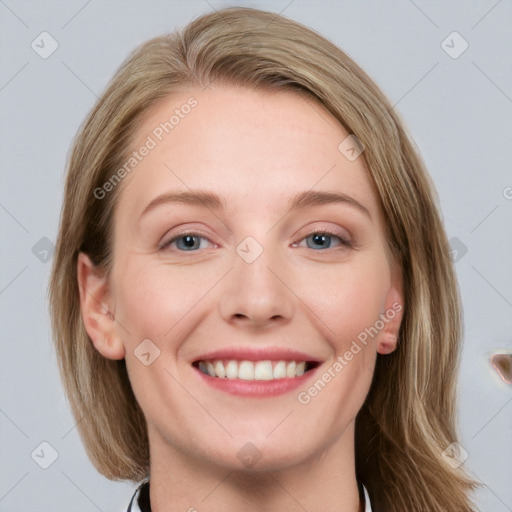 Joyful white young-adult female with medium  brown hair and blue eyes