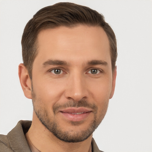 Joyful white young-adult male with short  brown hair and brown eyes