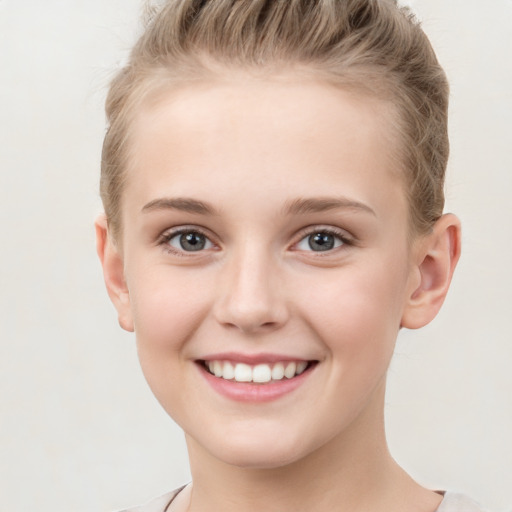 Joyful white child female with short  brown hair and grey eyes