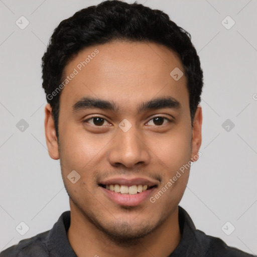 Joyful latino young-adult male with short  black hair and brown eyes