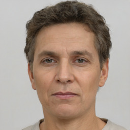 Joyful white adult male with short  brown hair and grey eyes