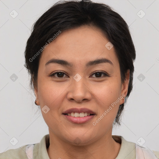 Joyful asian young-adult female with short  brown hair and brown eyes