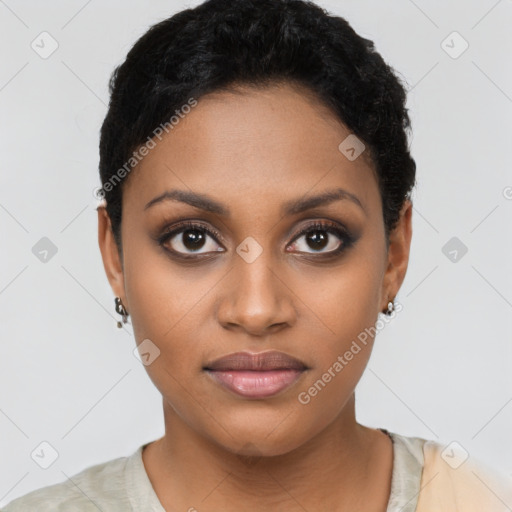 Joyful black young-adult female with short  black hair and brown eyes