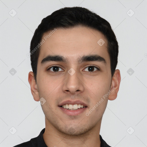 Joyful white young-adult male with short  black hair and brown eyes